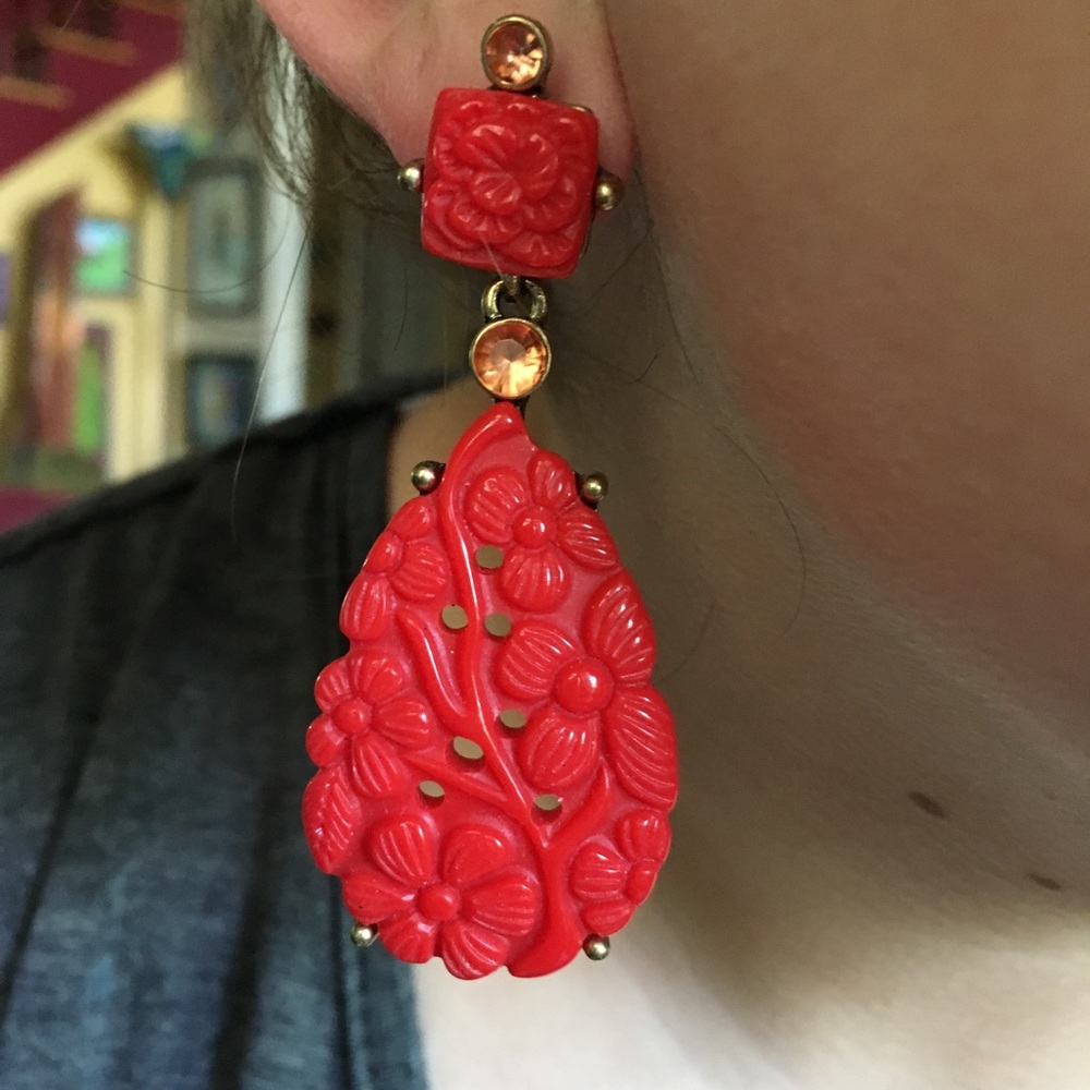 Such a fun pair of bright red earrings with coral